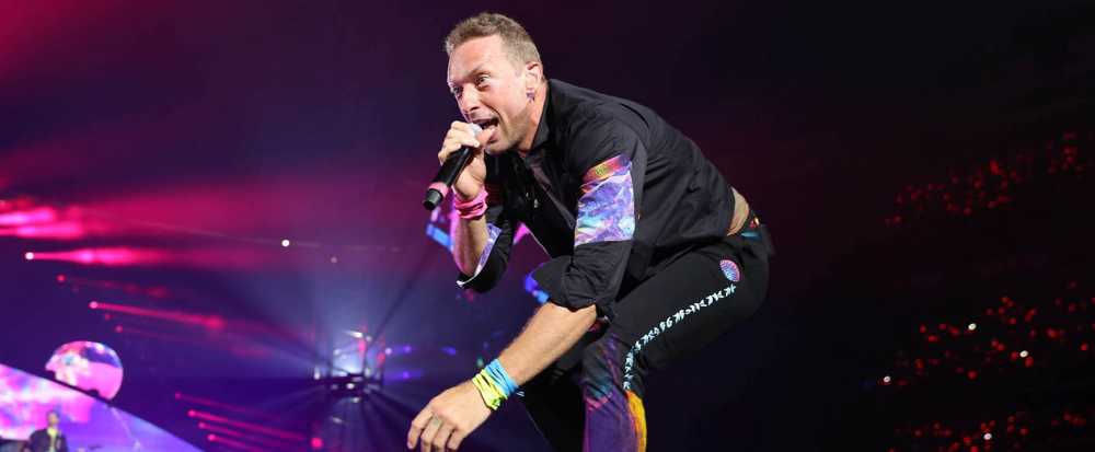 Coldplay's Chris Martin fights back tears as superfan travels 5000 miles from China to join him for unforgettable duet