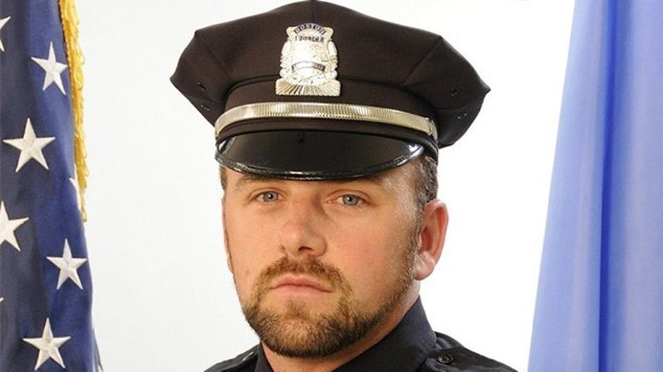 Woman accused of murdering Boston police officer boyfriend back in