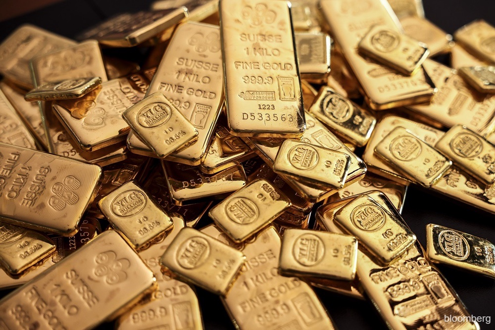 Gold rises as soft dollar, Trump's tariff threats spur safe-haven demand