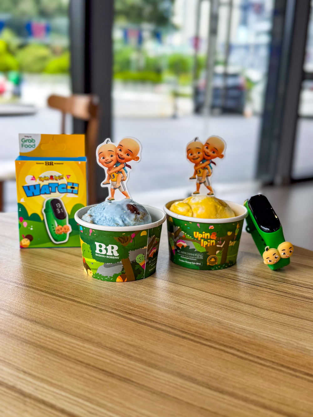 Image from: Khas Untuk Peminat Upin & Ipin! Kolaborasi Grab x Baskin-Robbins Menawarkan Jam Tangan & Cooler Bag Upin & Ipin Edisi Terhad!