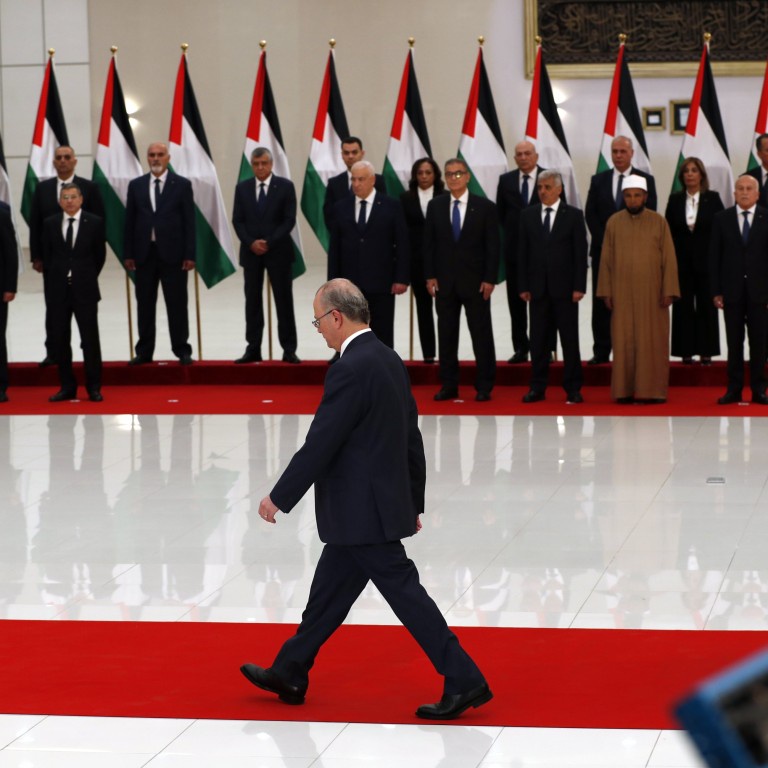 New Palestinian government gets wary greeting