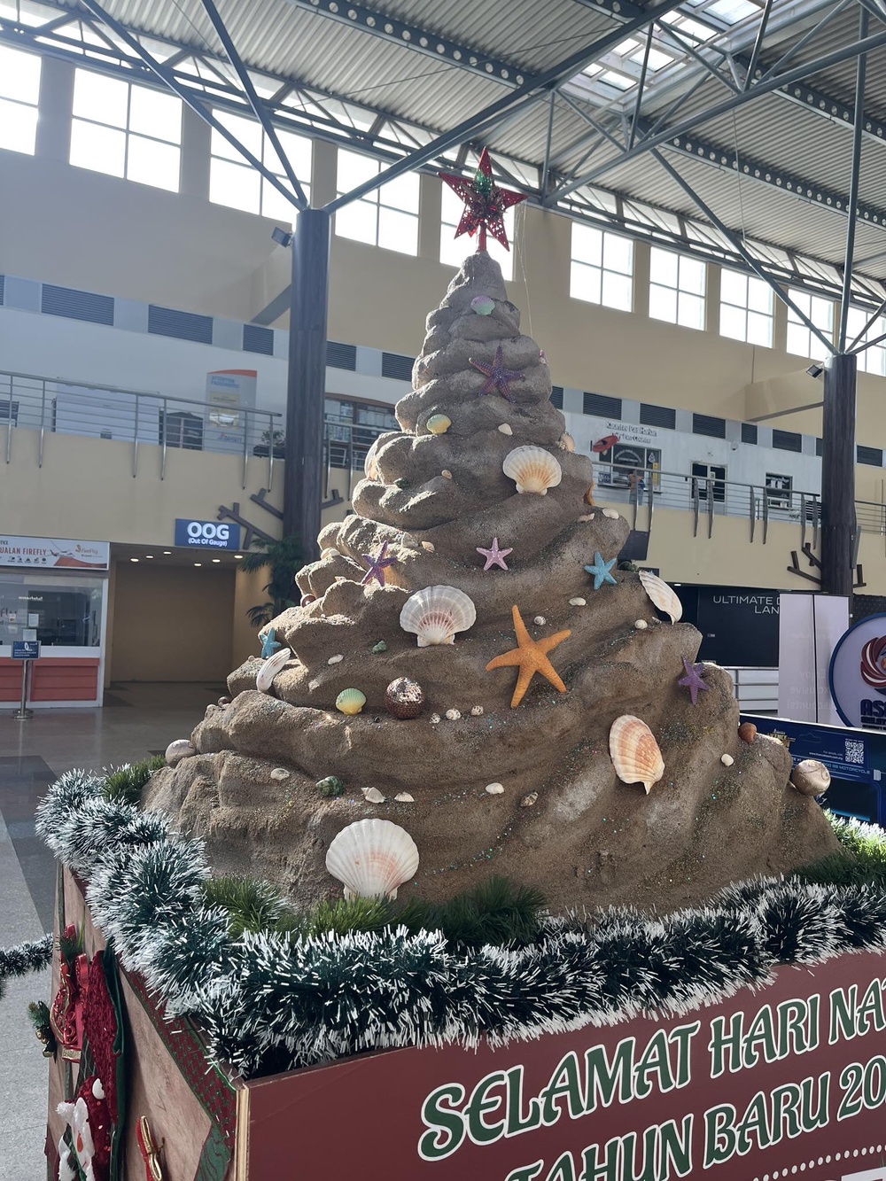 Image from: Langkawi Airport's 'unique' Christmas tree decoration ridiculed as Malaysians say it resembles a "pile of poop"