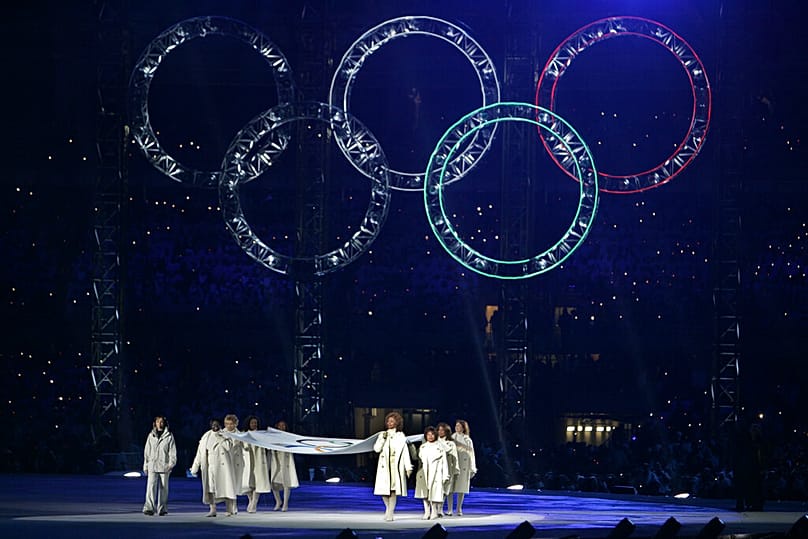 Italian actress Sophia Loren, right, leads notable women as they present the Olympic flag during the 2006 Winter Olympics opening ceremony in Turin 10 February 2006