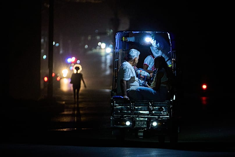 An electric tricycle transports customers during a blackout in Havana, 21 March, 2026