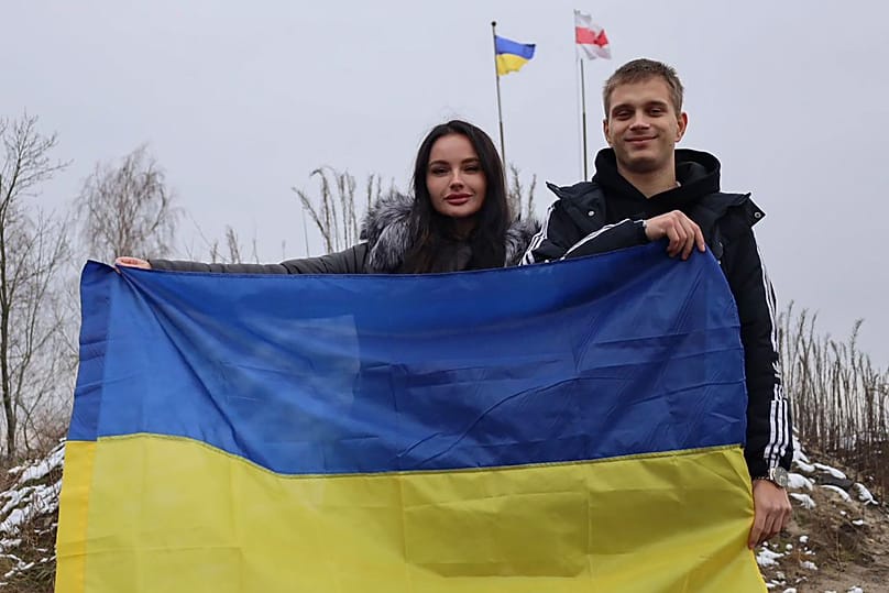 Ukrainian teenager Bohdan Yermokhin holds the Ukraine flag upon his return after forceful deportation to Russia, 19 November, 2023