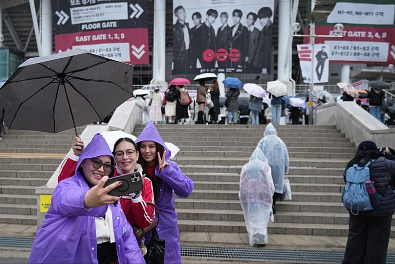 Strike a pose: BTS fans from Philippines take a souvenir photo ahead of the start of BTS world tour in Goyang, South Korea, 9 April 2026 