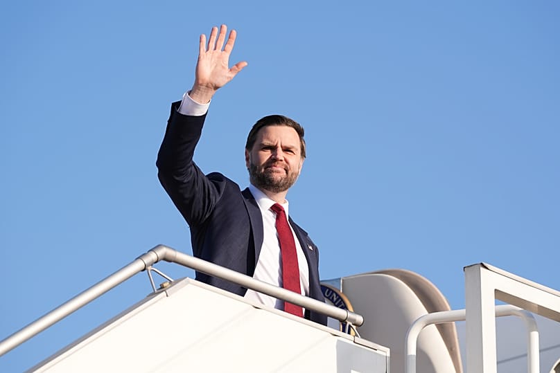 Vice President JD Vance waves as he boards Air Force Two after attending talks on Iran in Islamabad, Pakistan, Sunday, April 12, 2026.