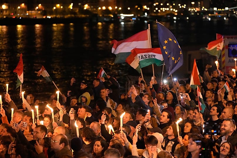 Supporters of Péter Magyar celebrate after a parliamentary election in Budapest, 12 April, 2026