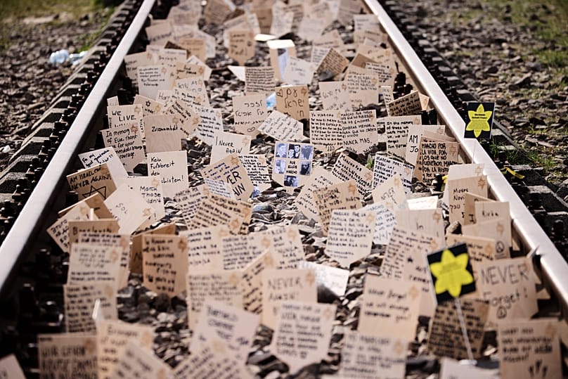 Signs are put between the rails during the annual 