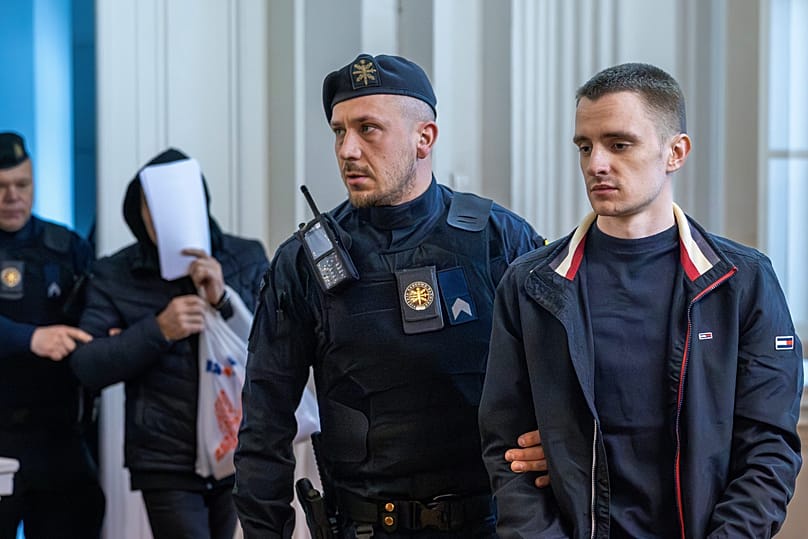 The suspects being brought into district court in Vilnius, 17 April, 2026