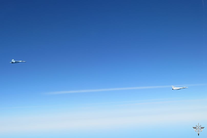 A Russian supersonic Tu-22M3 strategic bomber, right, and an escorting Su-35 Russian fighter jet fly together over the Baltic Sea, 20 April, 2026 