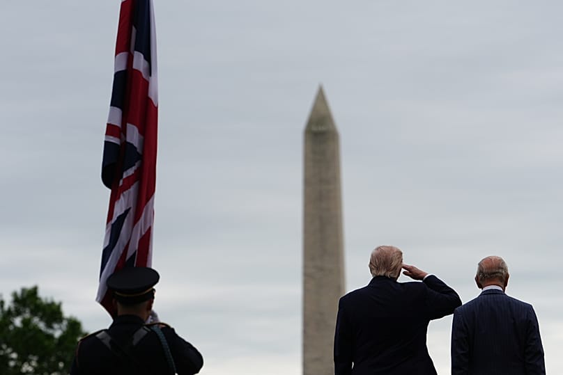 US President Donald Trump and King Charles III appear on stage during an arrival ceremony on the South Lawn of the White House, 28 April, 2026