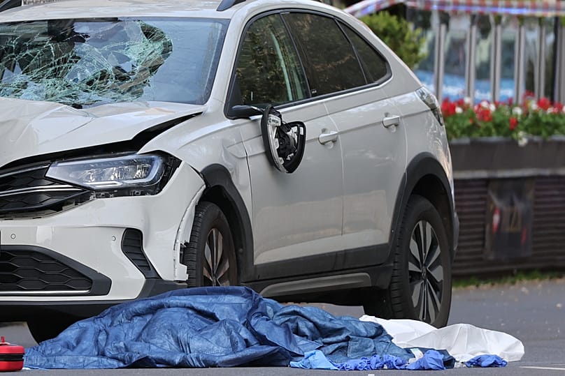 A damaged car that has crashed into several people is pictured in Leipzig, Germany, Monday, May 4, 2026