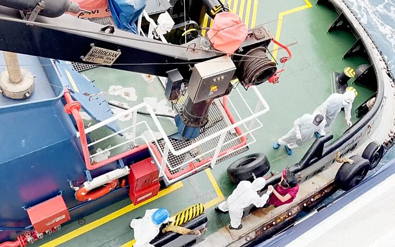 Health workers get off the Dutch-flagged MV Hondius, a cruise ship carrying nearly 150 people as it remains off Cape Verde on 4 May, 2026 