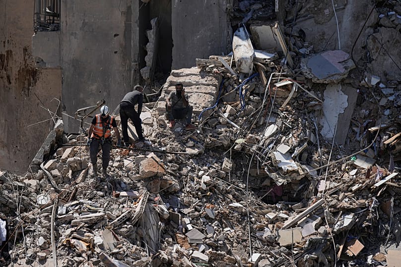 Rescue workers search through the rubble of a damaged building for survivors following an Israeli airstrike in Dahiyeh, 7 May, 2026