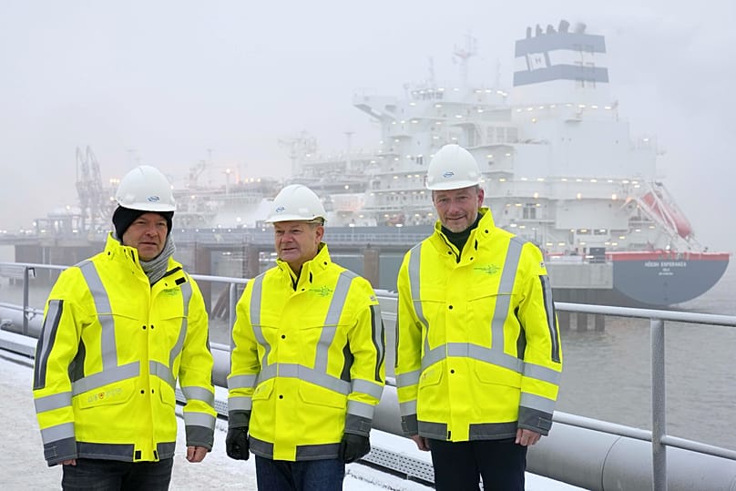 FILE. Former German Chancellor Olaf Scholz poses in front of the floating LNG terminal 
