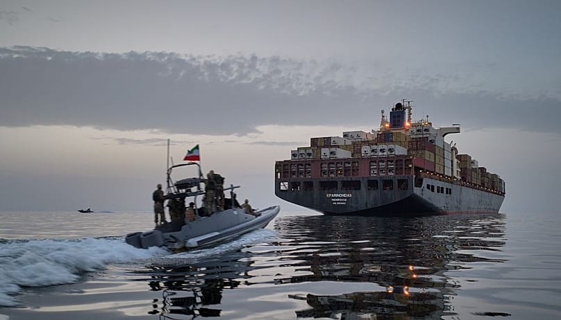 FILE - In this photo released by Tasnim News Agency, a Revolutionary Guard Navy (IRGC) speedboat approaches the cargo ship Epaminondas during what state media described as the