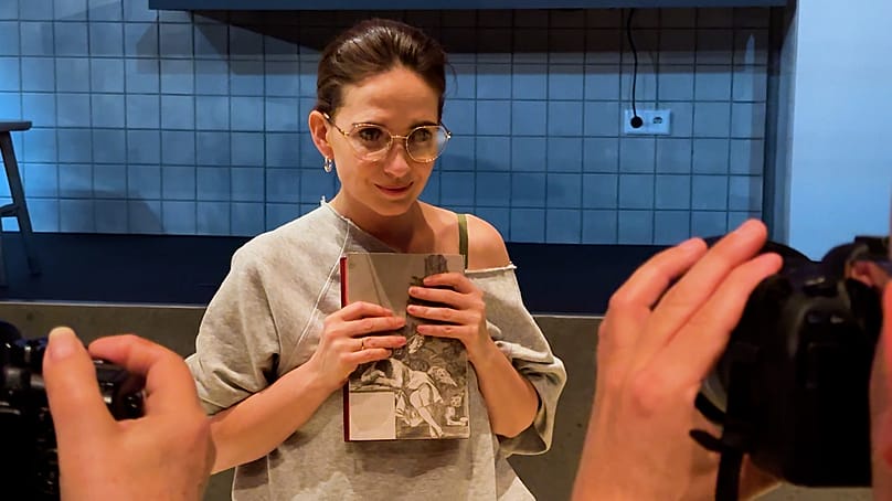 Anna Cieślak, the actress playing the role of the Reader in the production 