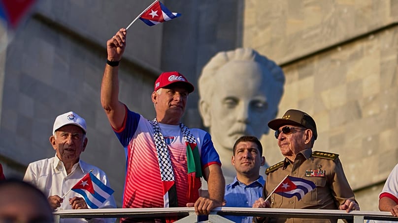 FILE: Raúl Castro, right, accompanied by president Miguel Díaz-Canel, second from left, in Revolution Square in Havana, 1 May 2025.
