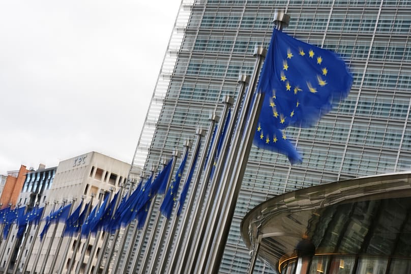 European Union flags flap in the wind outside EU headquarters in Brussels, 12 May, 2026