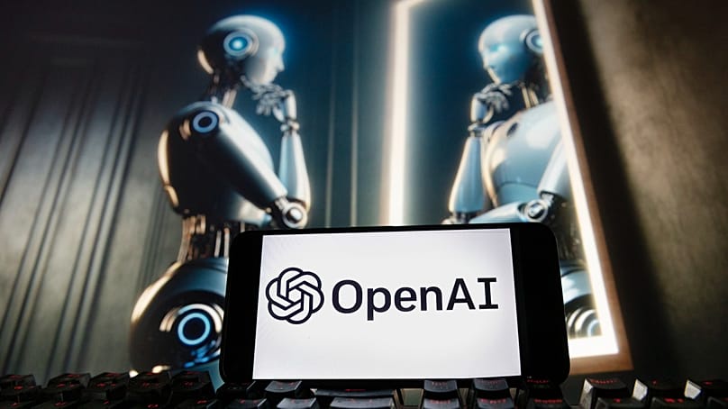 FILE - The OpenAI logo is displayed on a cellphone on a computer monitor generated by ChatGPT's Dall-E text-to-image model, Dec. 8, 2023, in Boston.