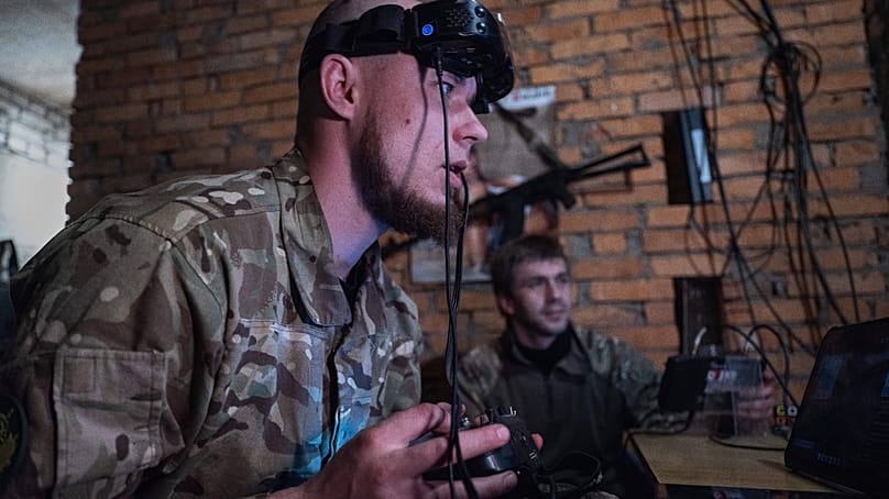 Servicemen control FPV drones from a shelter in Druzhkivka, Donetsk region, Ukraine, Thursday, May 7, 2026.