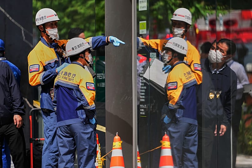 Tokyo firefighters examine the scene after a person allegedly sprayed a substance that caused an odour in Tokyo, 25 May, 2026