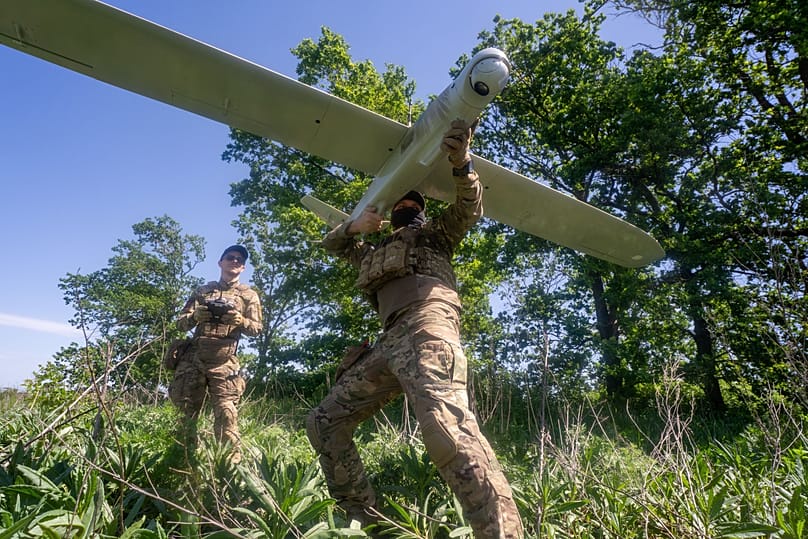 Ukrainian servicemen from the 'Khartia' brigade launch a drone towards Russian positions along the front line in Ukraine's Kharkiv region, Wednesday 20 May 2026.