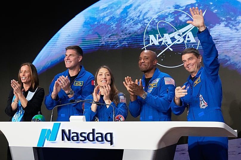 NASA' Artemis II astronauts accompanied by Nasdaq CEO Adena T. Friedman ring the closing bell in New York, 30 April 2026