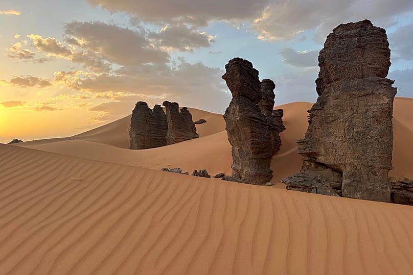 Rock formations stand in the Sahara desert outside the city centre of Djanet, 5 July, 2025