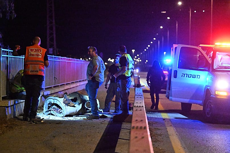 Israeli security forces examine a fragment of an intercepted Iranian missile in northern Israel, early Monday, June 8, 2026. 