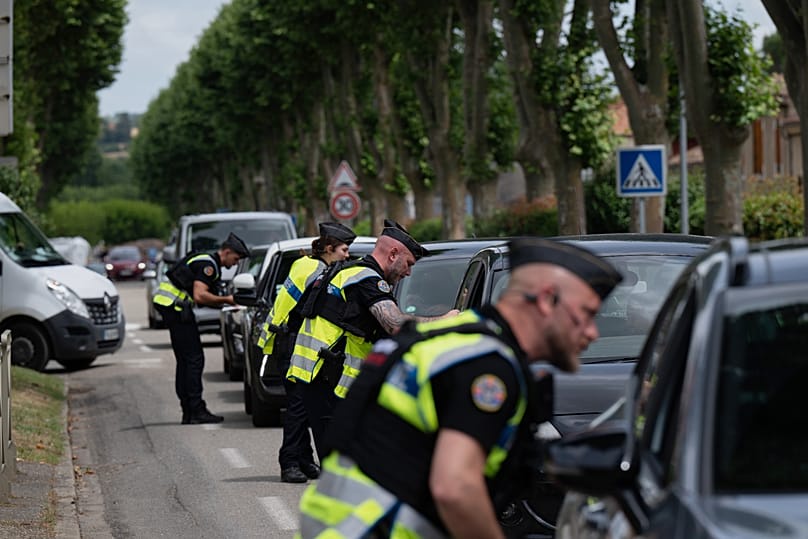 Police inspect vehicles during the search for evidence in the case of missing 11-year-old Lyhanna in Fleurance, 5 June, 2026