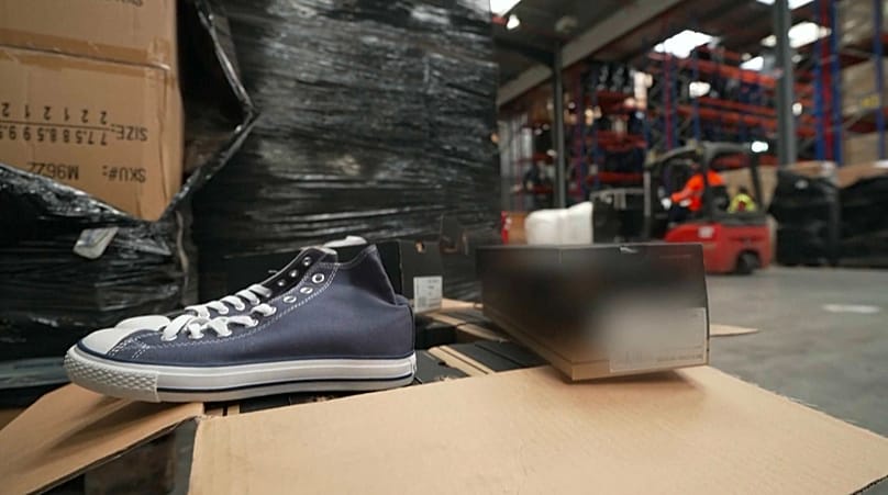 One of the counterfeit pairs of trainers taken out of its box