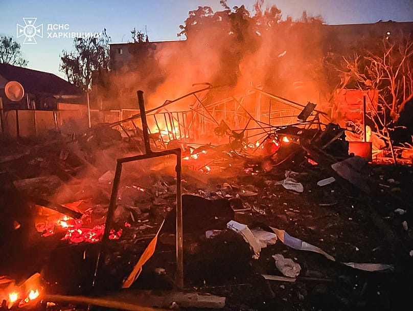 A damaged building burns after a Russian strike in Kharkiv, 9 June, 2026