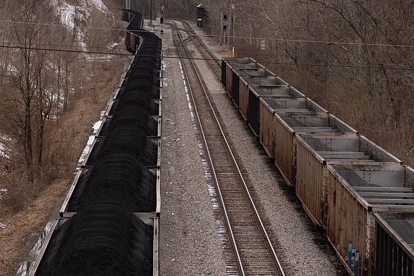 FILE - A train with coal pauses on the tracks in Grafton, W.Va., March 18, 2026. 