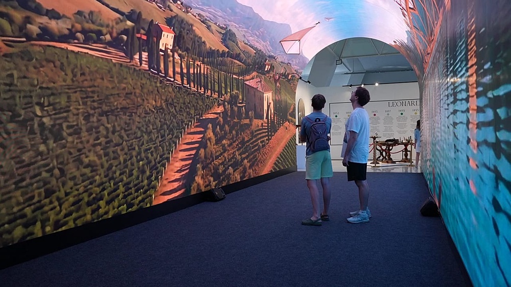 Visitors explore an LED tunnel at the exhibition.