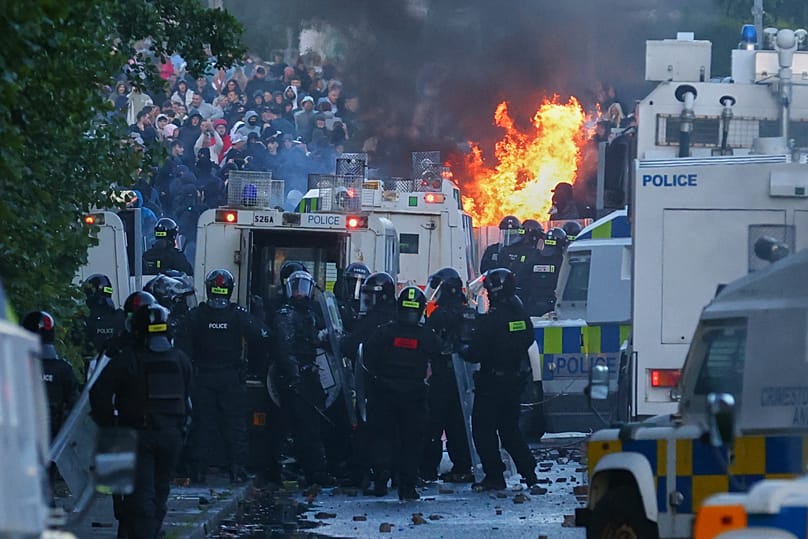 Police attempt to clear protesters near Newtownabbey following a stabbing incident, 10 June, 2026