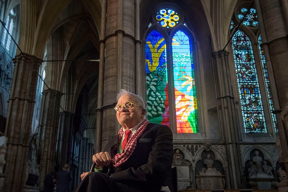 FILE: David Hockney sits in front of The Queen's Window, a new stained glass window at Westminster Abbey, London, designed by David Hockney, 2018. 
