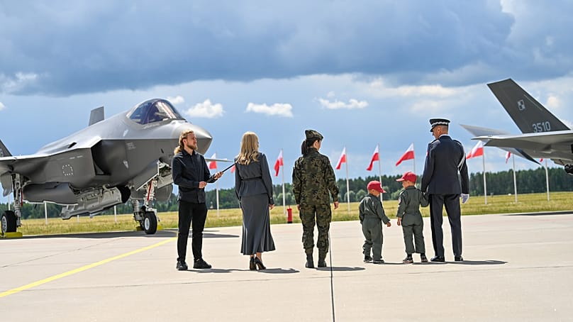 Symbolic christening of F-35 fighter aircraft.