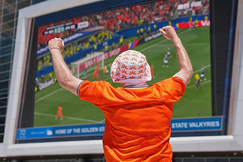 A Dutch fan celebrates his team's goal against Japan as he watches a public viewing of the World Cup match against Japan in San Francisco, Sunday June 14, 2026