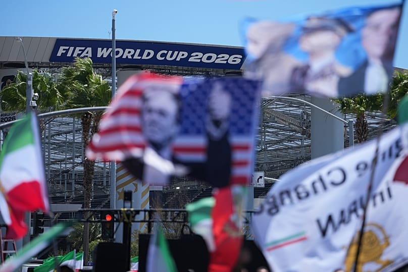 People protest outside Los Angeles Stadium before the World Cup Group G soccer match between Iran and New Zealand in Inglewood, CA, 15 June 2026