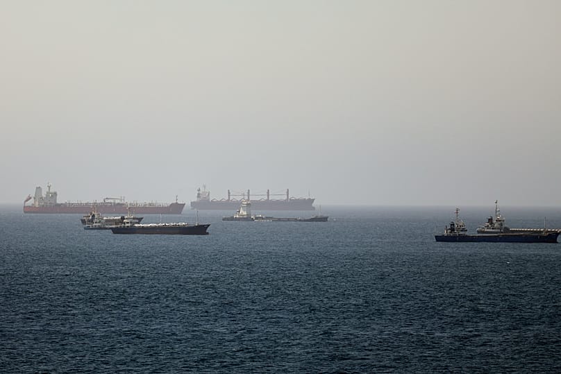 FILE: Tankers and cargo vessels are seen in the Gulf of Oman, along shipping routes in the Strait of Hormuz, 16 June 2026