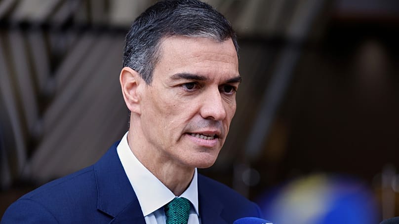 Spain's Prime Minister Pedro Sanchez speaks with the media as he arrives for an EU summit at the European Council. (AP Photo/Omar Havana)