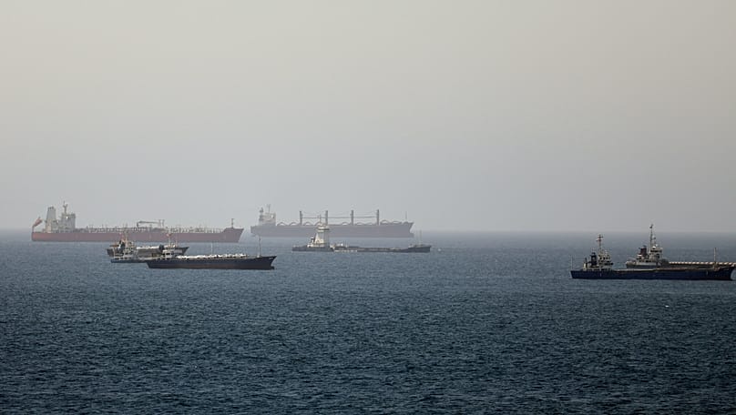 Tankers and cargo vessels are seen in the Gulf of Oman, along shipping routes linking the Strait of Hormuz and the Arabian Sea, Tuesday, June 16, 2026.