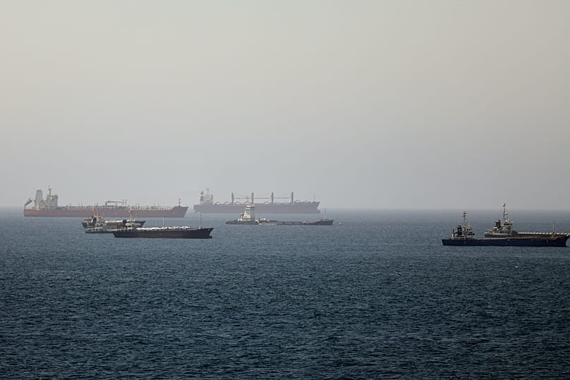 Tankers and cargo vessels are seen in the Gulf of Oman along shipping routes linking the Strait of Hormuz and the Arabian Sea, 16 June, 2026