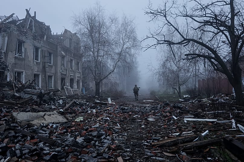 FILE: A Ukrainian soldier goes along a street in the frontline town of Kostyantynivka, the site of heavy battles with the Russian troops in the Donetsk region, Ukraine, 28 Nov