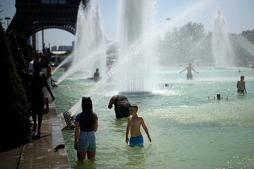 People cooling off in the fountains in the Trocadéro gardens in Paris, archive images