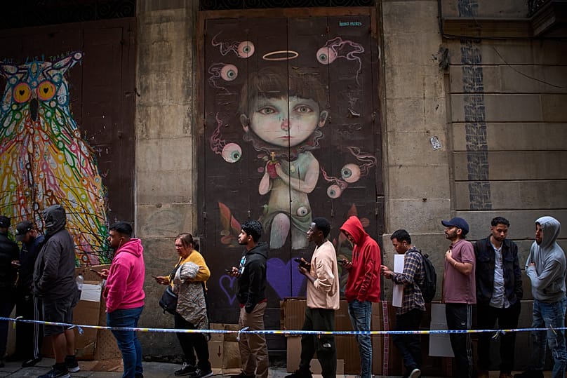 Migrants queue outside Barcelona City Hall, 29 April, 2026
