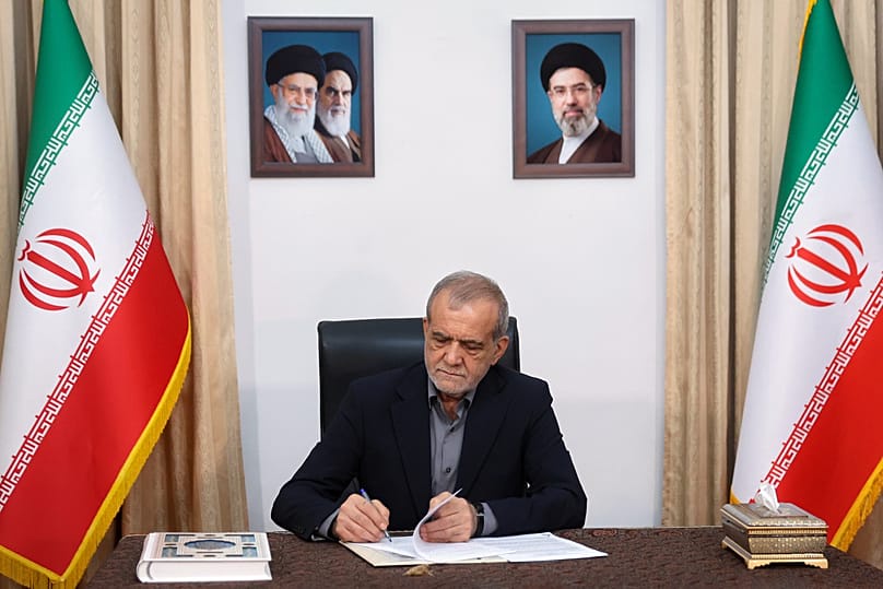 Iranian President Masoud Pezeshkian signs an MoU aimed at ending the war in Tehran, 18 June, 2026