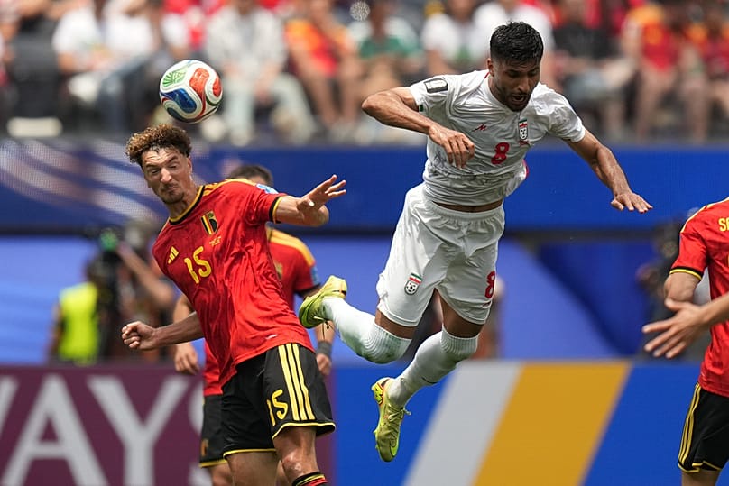 Belgium's Thomas Meunier heads the ball past Iran's Mohammad Mohebbi during the World Cup Group G match in Inglewood, California, near Los Angeles, Sunday, June 21, 2026